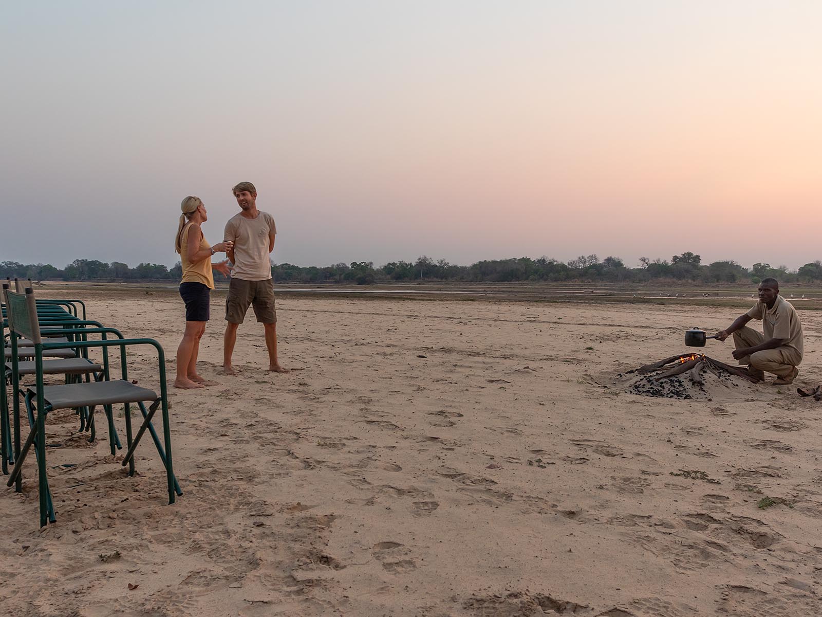 Sundowners and campfire, Luangwa River, Luambe National Park; photograph taken on safari in Zambia - Wildlife & Wilderness
