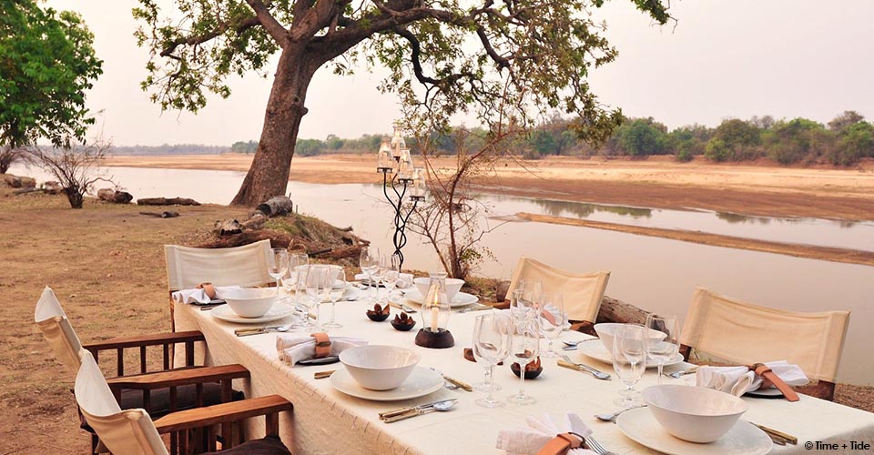 Outside dining beside the Luangwa River at Mchenja camp, South Luangwa, Zambia