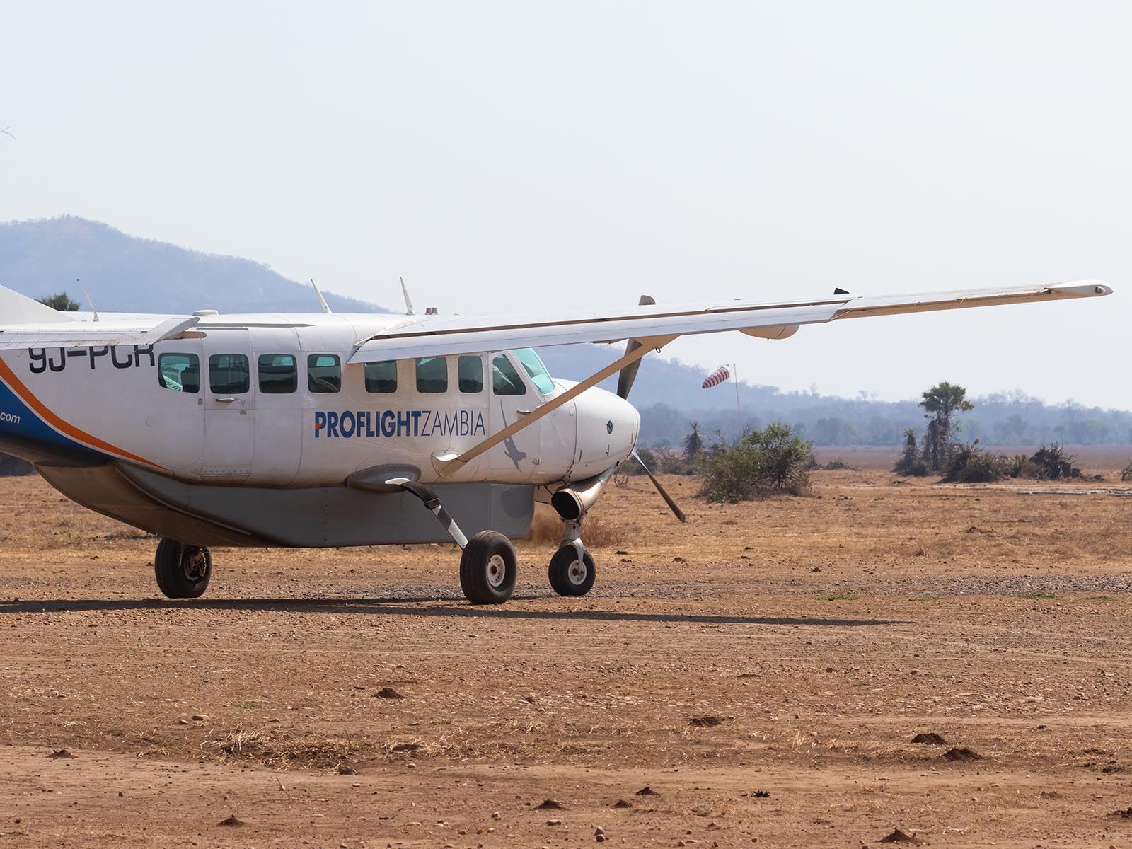 Proflight Zambia aircraft on the airstrip at Jeki, Lower Zambezi National Park; photograph taken on safari in Zambia by Wildlife & Wilderness