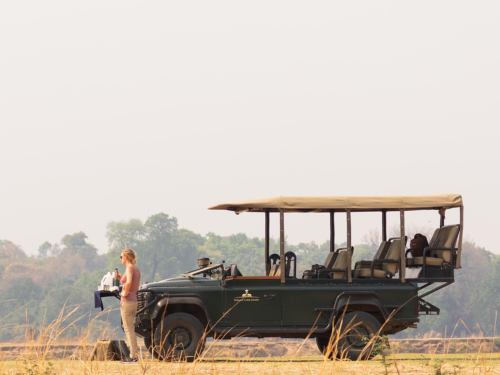 Morning coffee break with vehicle on safari in South Luangwa National Park, Zambia; photograph - Wildlife & Wilderness