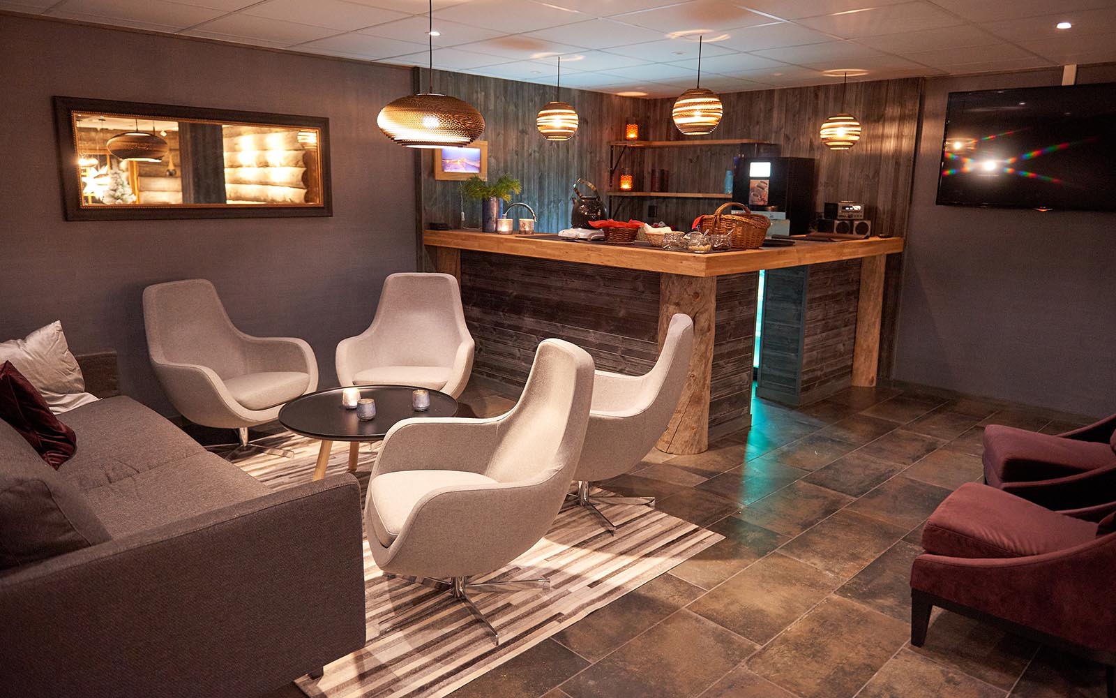 The main lodge building offers comfortable chairs in the guest lounge and bar at Brandon Lodge on the edge of the Luleå archipelago in Swedish Lapland