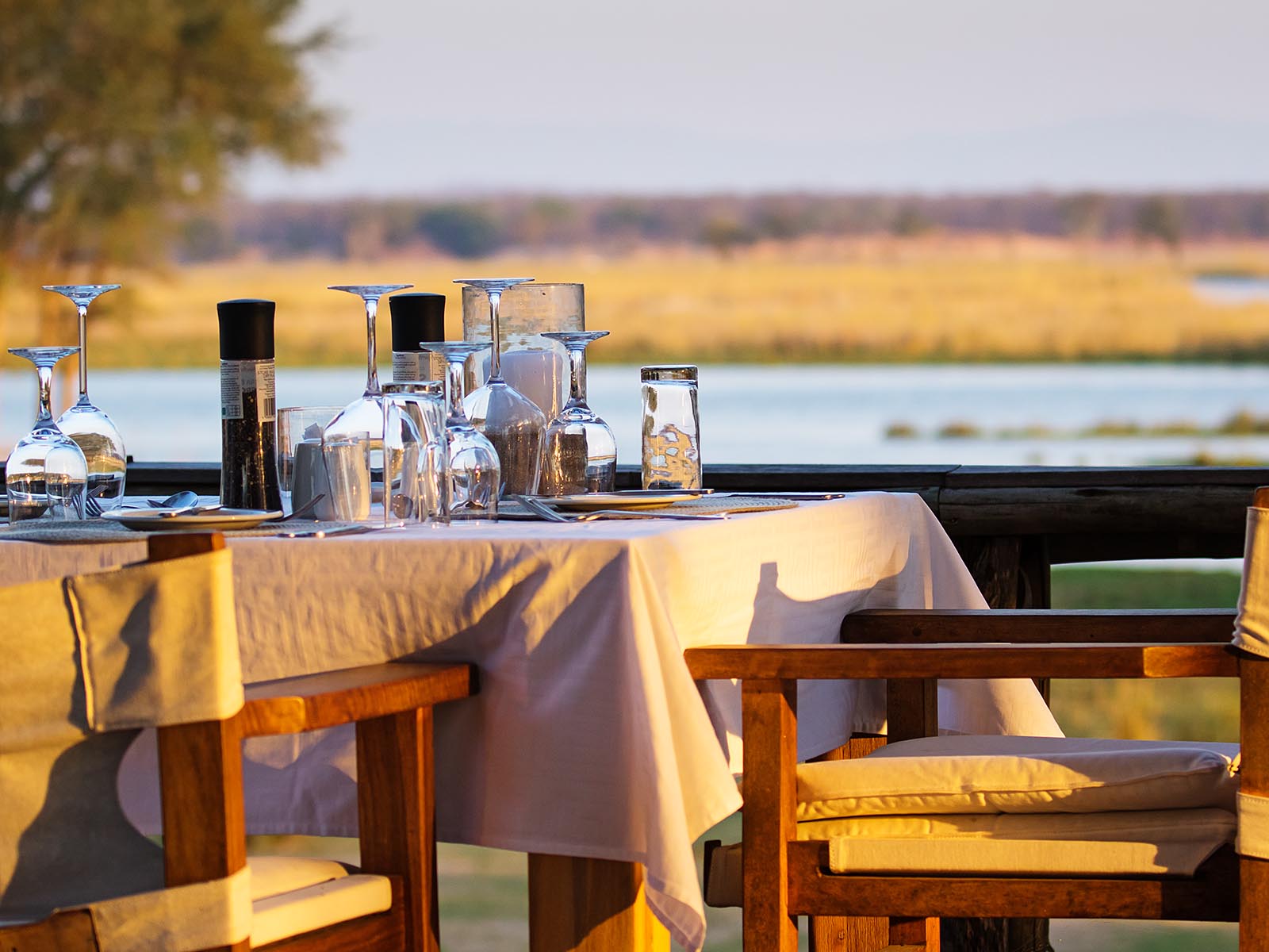 Dining table set at Anabezi Camp beside the Zambezi River; photograph taken in Lower Zambezi National Park by Wildlife & Wilderness on safari in Zambia