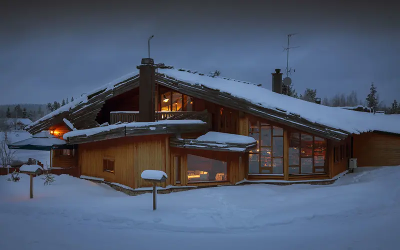 The exterior facade of Hotel Yllas Humina in Akoslompolo, Finnish Lapland in winter