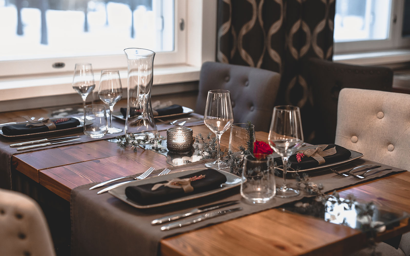 An elegantly dressed table setting in the restaurant at Beana Laponia, a boutique lodge in Lapland.  