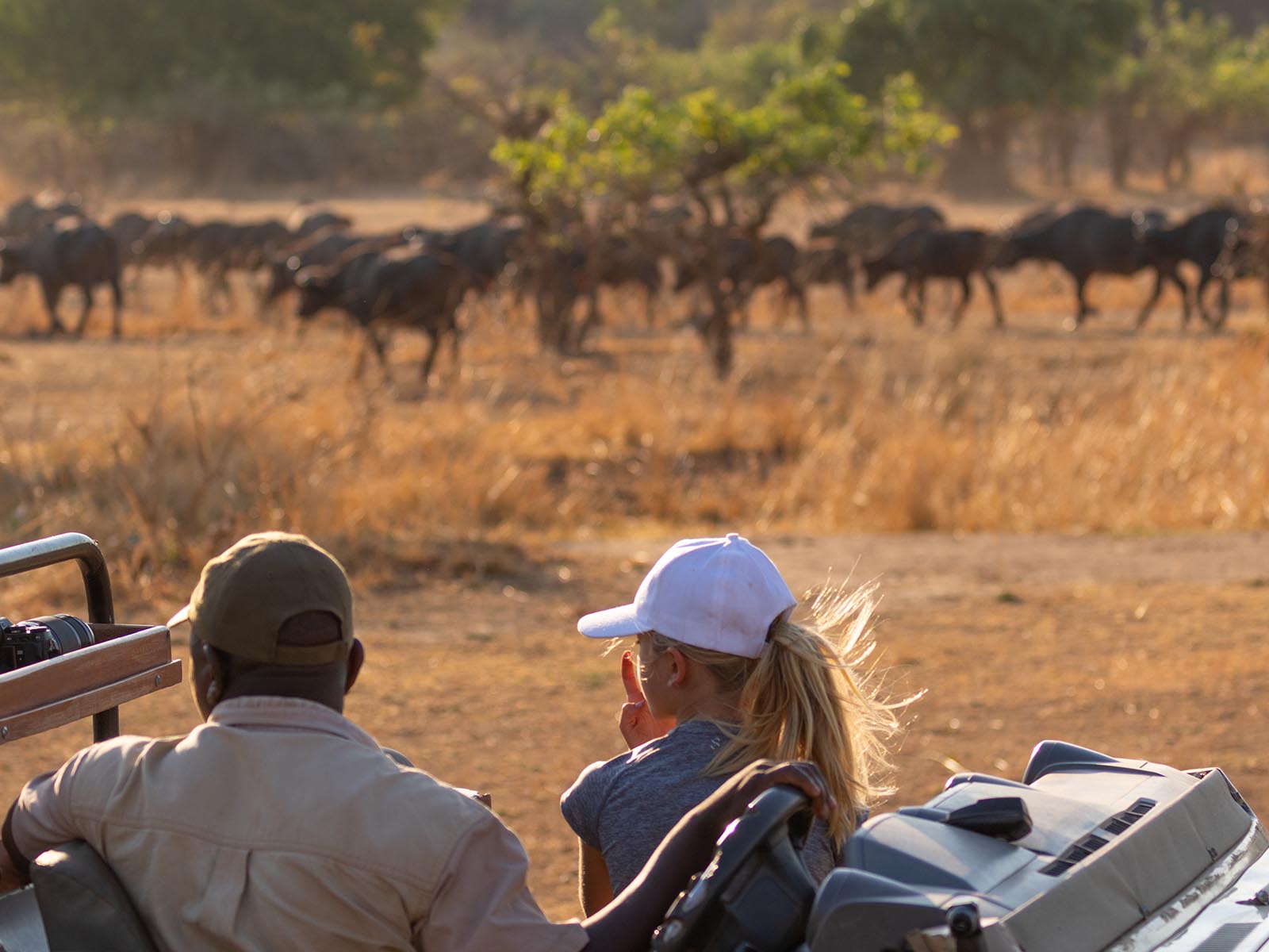 Safari guide and child watching wildlife in South Luangwa; photograph taken on safari in Zambia by Wildlife & Wilderness