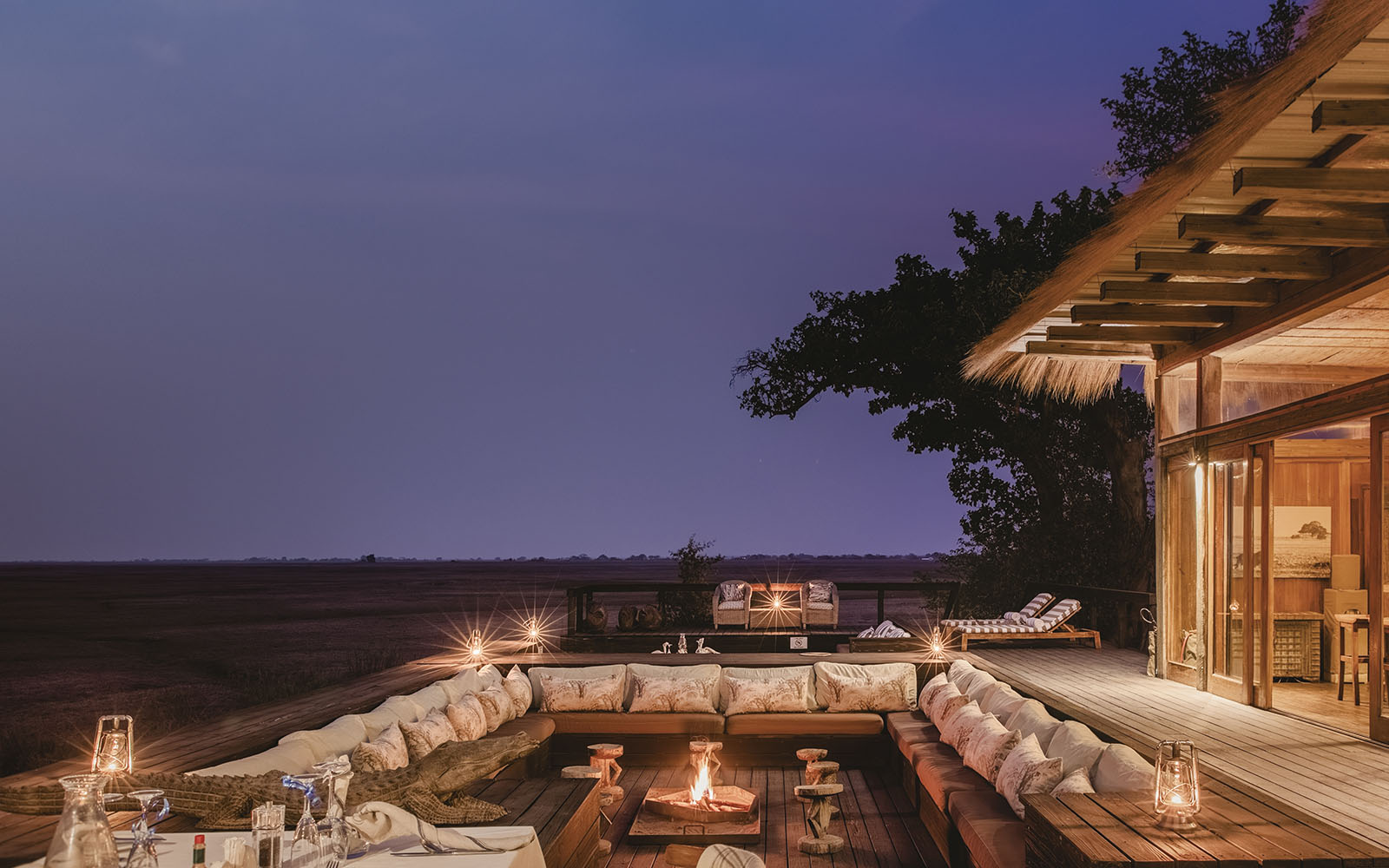 Nightime sunken seating area in the main public area at Shumba Camp, Kafue, Zambia