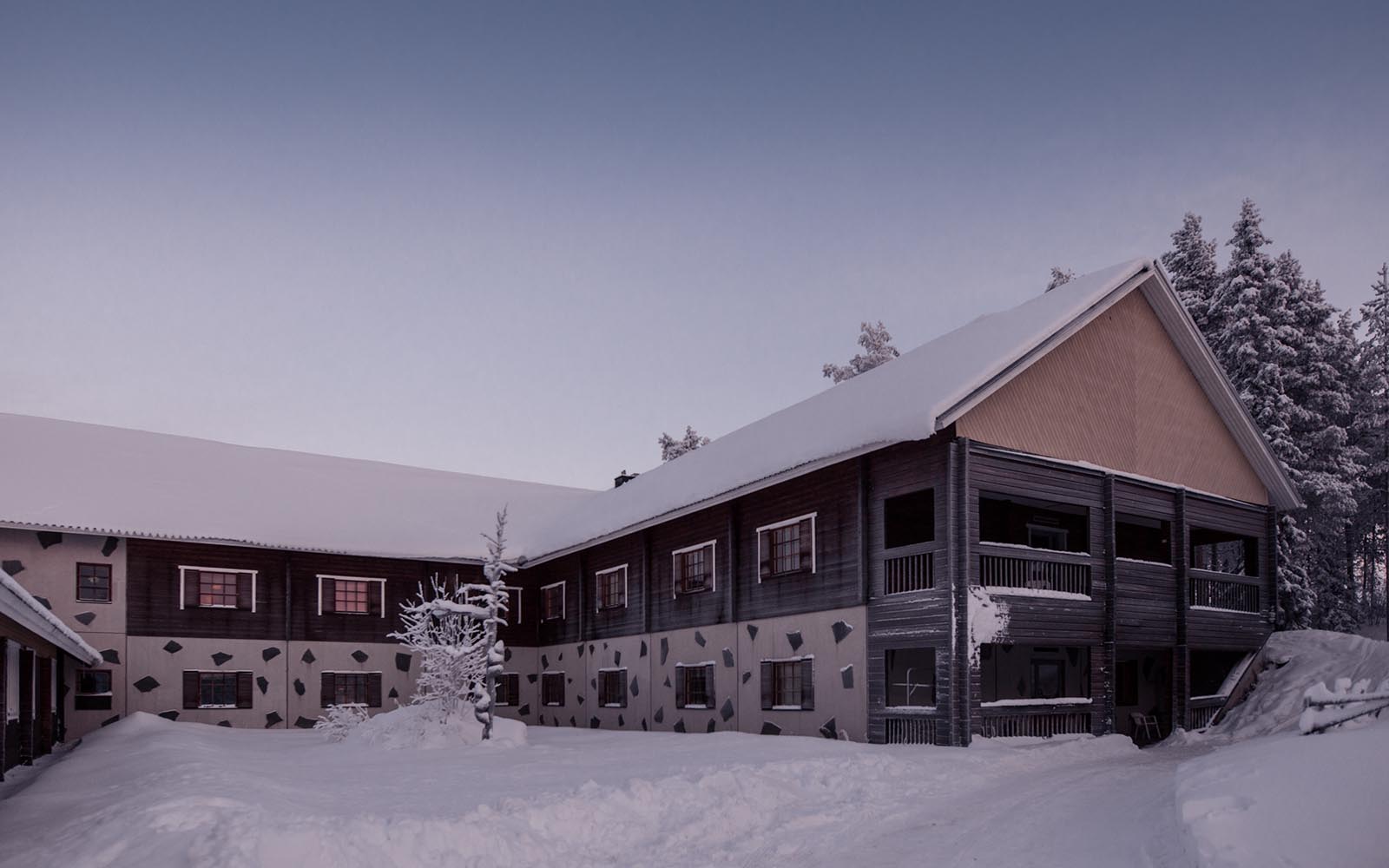 The exterior facade of Harriniva Adventure Resort near Muonio in Finnish Lapland in winter