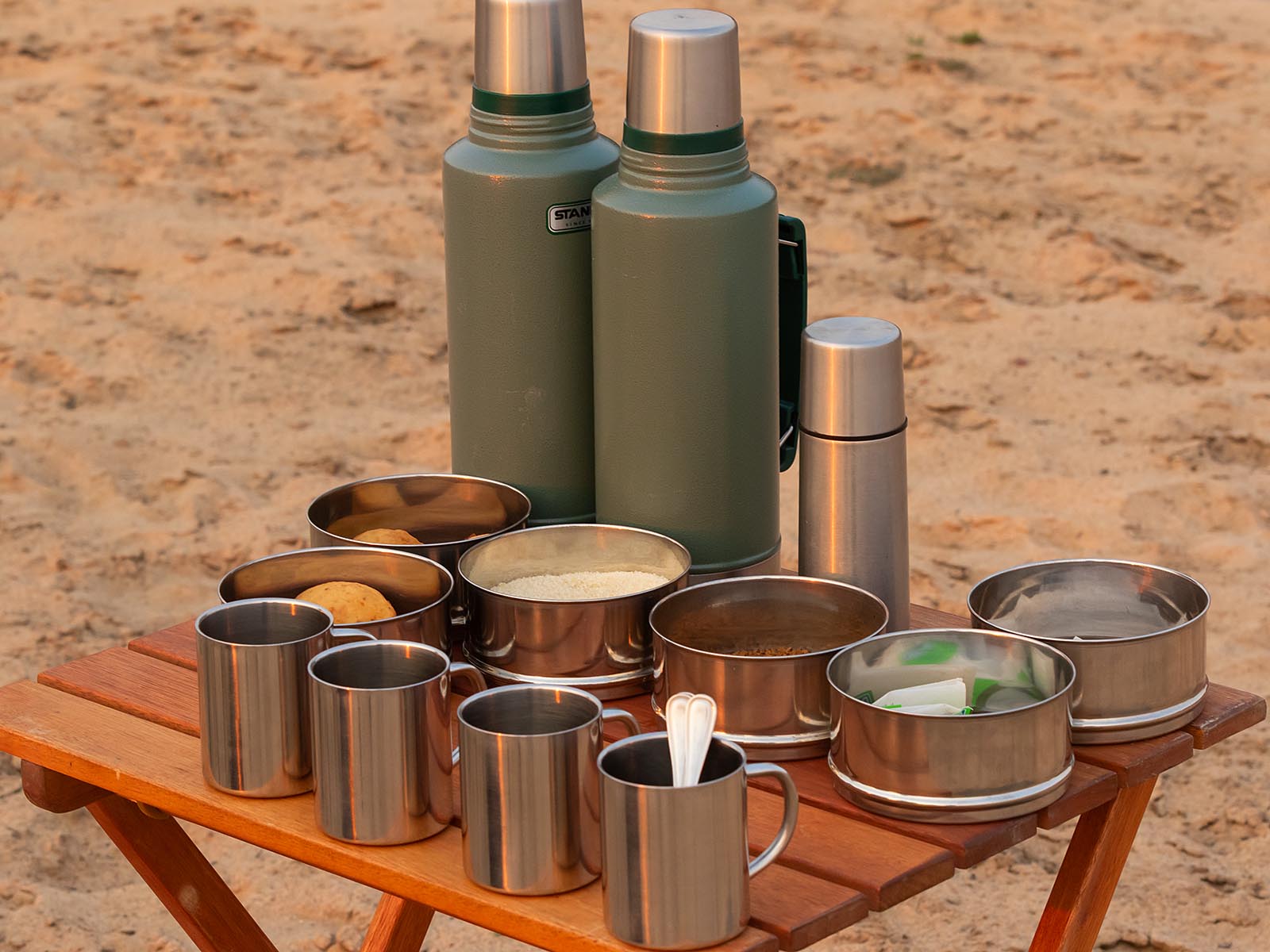Morning coffee stand with mugs and flasks; photograph by Wildlife & Wilderness taken on safari in Luambe National Park, Zambia