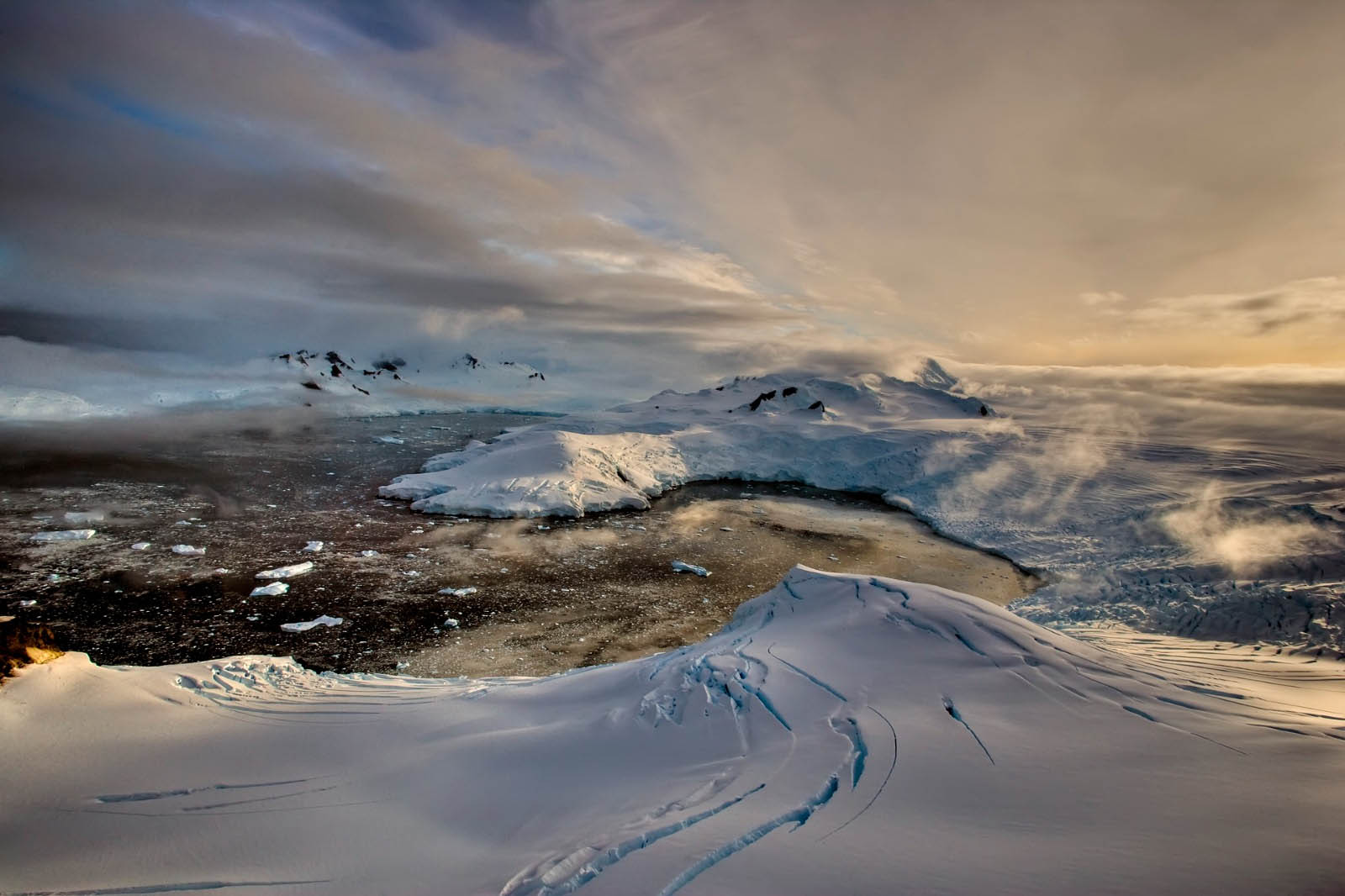 View of an icy bay from the top of a mountain with glaciers, Antarctica